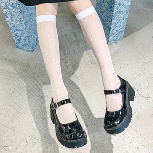 Classic black platform Mary Jane shoes with white polka dot mesh socks in retro style