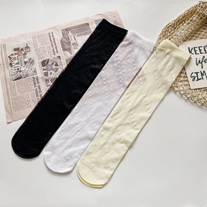 Set of ultra-thin transparent polka dot knee-high socks in black, white and beige colors