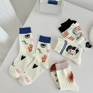 Artistic mid-calf socks set with hand-drawn abstract illustrations and cotton texture