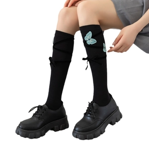 Japanese Lolita style knee high socks with blue butterfly embroidery and ribbon ties