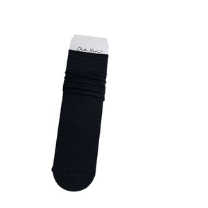 Black ribbed crew socks with a slouchy design on a plain white background