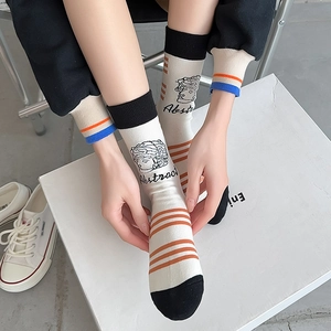 Artistic mid-calf cotton socks featuring abstract bust portrait and orange stripes