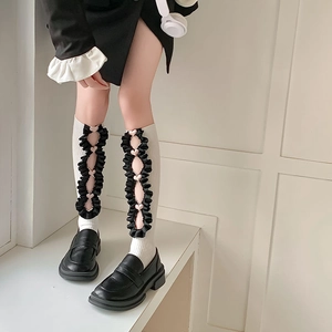 Lolita style white ribbed knee-high socks with pink hearts and black ruffles