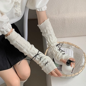 Lolita style white cable knit long arm warmers with black ribbon bows and ruffle cuffs
