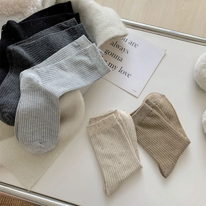 Detail of five-pair ribbed cotton socks set with colorful Donegal fleck texture