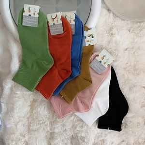 Pack of 7 colorful ribbed mid-calf cotton socks in vibrant candy colors for women