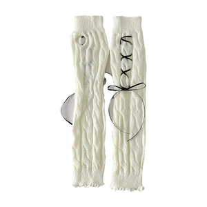 White Lolita knit long fingerless gloves with black ribbon bows and cable knit texture