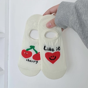 Detail of cotton no-show socks with cherry and smiling heart patterns and text