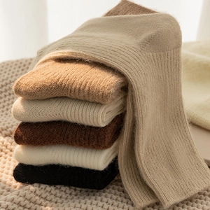 Close-up of thick ribbed knit socks in assorted warm earthy tones and soft texture