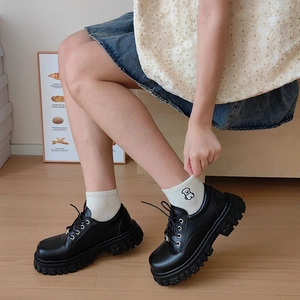 Vintage black platform leather shoes with white embroidered crew socks for women