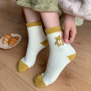 Plush coral fleece mid-calf socks with cute cartoon bear patch in white and yellow colors