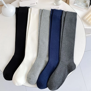 Japanese style knee-high socks in five solid colors like black and white for women
