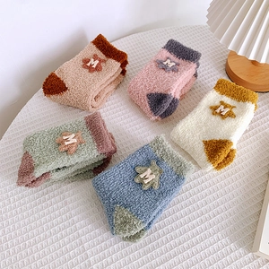 Set of five thick coral fleece socks with cute M patches in various warm pastel colors