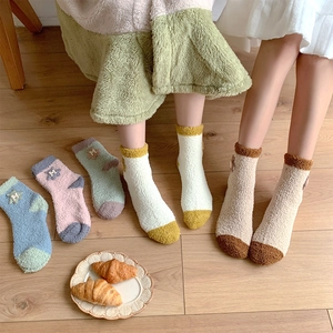 Thick coral fleece socks for women featuring colorful patchwork and cute star patches
