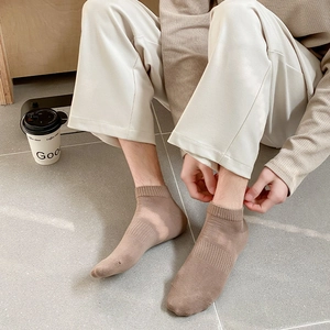 Close-up of brown cotton low-cut sport socks with ribbed cuffs for men