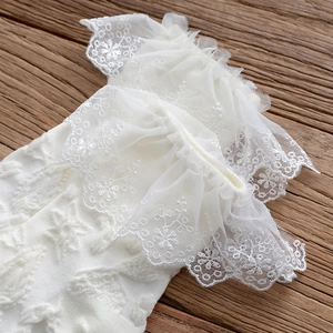 Detailed close-up of white lolita lace mesh socks with vintage floral embroidery pattern