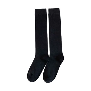 Classic black knee-high school style socks with ribbed elastic cuffs on white background