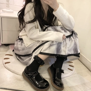Detail of sweet Lolita style black lace calf socks paired with Mary Jane shoes