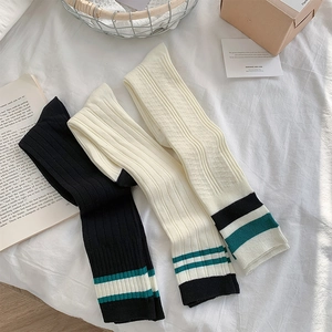 Detailed texture of cotton knit knee-high socks with college style double stripes