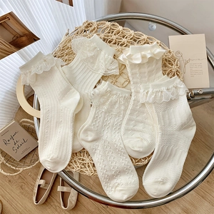 Detail of five pairs of off-white Lolita lace crew socks with vertical knit patterns