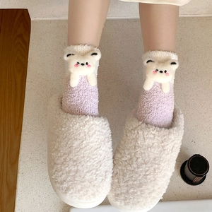 Detail of plush purple coral fleece socks with 3D bear doll and cream house slippers