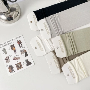 Detailed knit texture of loose crew socks in six assorted colors with brand tags