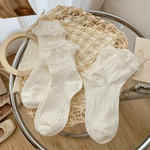 Cream white Lolita style lace trim socks with vertical stripes and ruffled edges