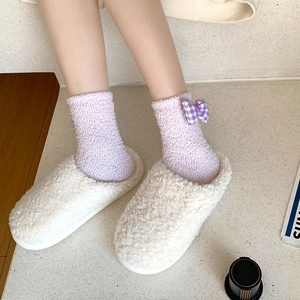 Cozy coral fleece socks with purple plaid bows and white faux fur plush slippers