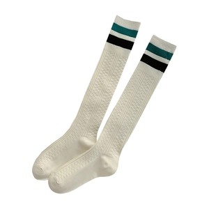 Japanese style white knee high socks with green stripes and textured cable knit pattern