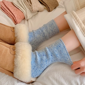 Close-up of thick knitted wool socks with colorful speckles paired with winter boots
