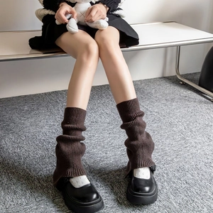 Dark brown knitted leg warmers for women featuring a slouchy style and thick ribbed texture