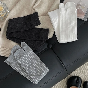 Close-up of minimalist cotton tabi socks with vertical ribbed texture for flip-flops