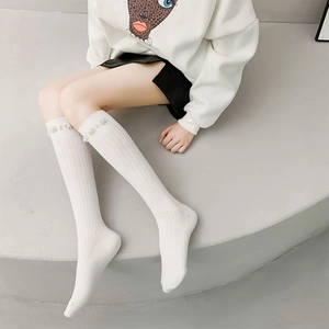 Elegant white ribbed knee-high socks with pearl embellishments for a stylish JK look