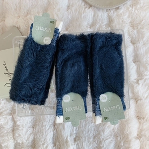 Three pairs of thick navy blue plush socks with warm faux mink texture and paper packaging