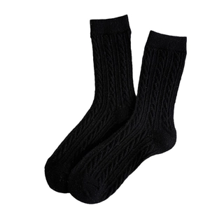 Classic black cable-knit mid-calf socks for women with a warm thick texture