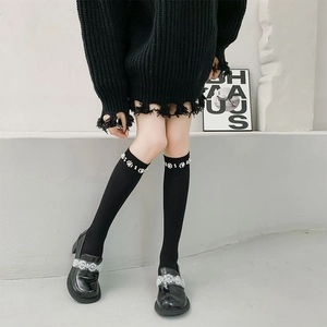 Black knit over-the-knee socks with elegant pearl flower accents and sparkly rhinestones