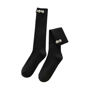 Black ribbed knee-high socks with elegant white pearl flower embellishment for women