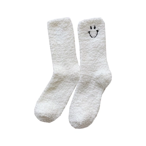 White coral fleece socks with cute smiley embroidery for winter warmth and cozy home wear
