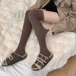 Thick wool over-knee high socks in brown with warm fleece-lined buckle sandals