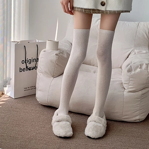 Thick winter over-knee socks in cream white with vertical ribbed knit texture
