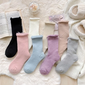 Detail showing plush thick texture and rolled edge design of warm winter socks in seven colors