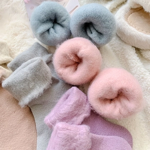 Detailed view of the thick fleece lining and soft texture on various winter thermal socks