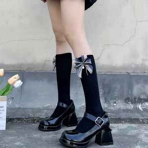 Japanese style black calf socks with bows and pearls paired with platform Mary Janes