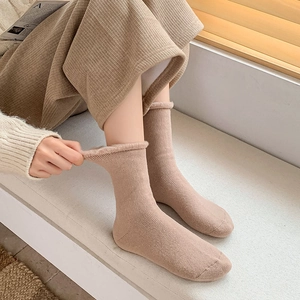 Detail of warm winter socks showing the thick fleece lining and ribbed knit texture