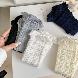 Detail of five-color cable knit Lolita socks with delicate lace trim and soft texture