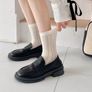 Japanese style cream mesh five-finger socks paired with black platform loafers
