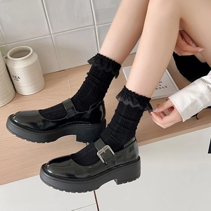 Lolita style black shiny patent leather Mary Janes with layered lace trim ankle socks
