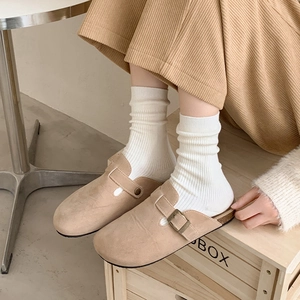 Classic khaki suede clogs with metal buckle paired with white knit crew socks