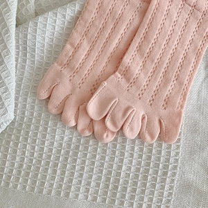 Detail of pink pointelle knit five-toe socks with breathable hollow mesh texture