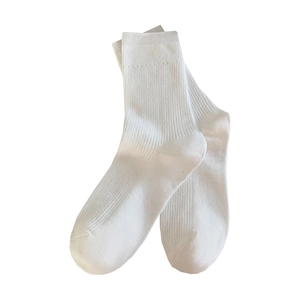 Classic white ribbed crew socks for women featuring minimalist vertical stripe texture